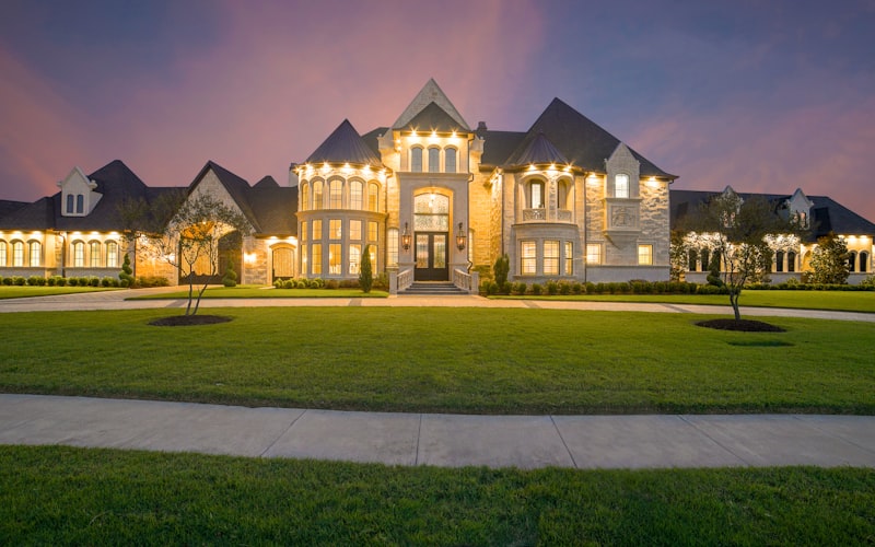 Professionally lit modern home exterior at twilight