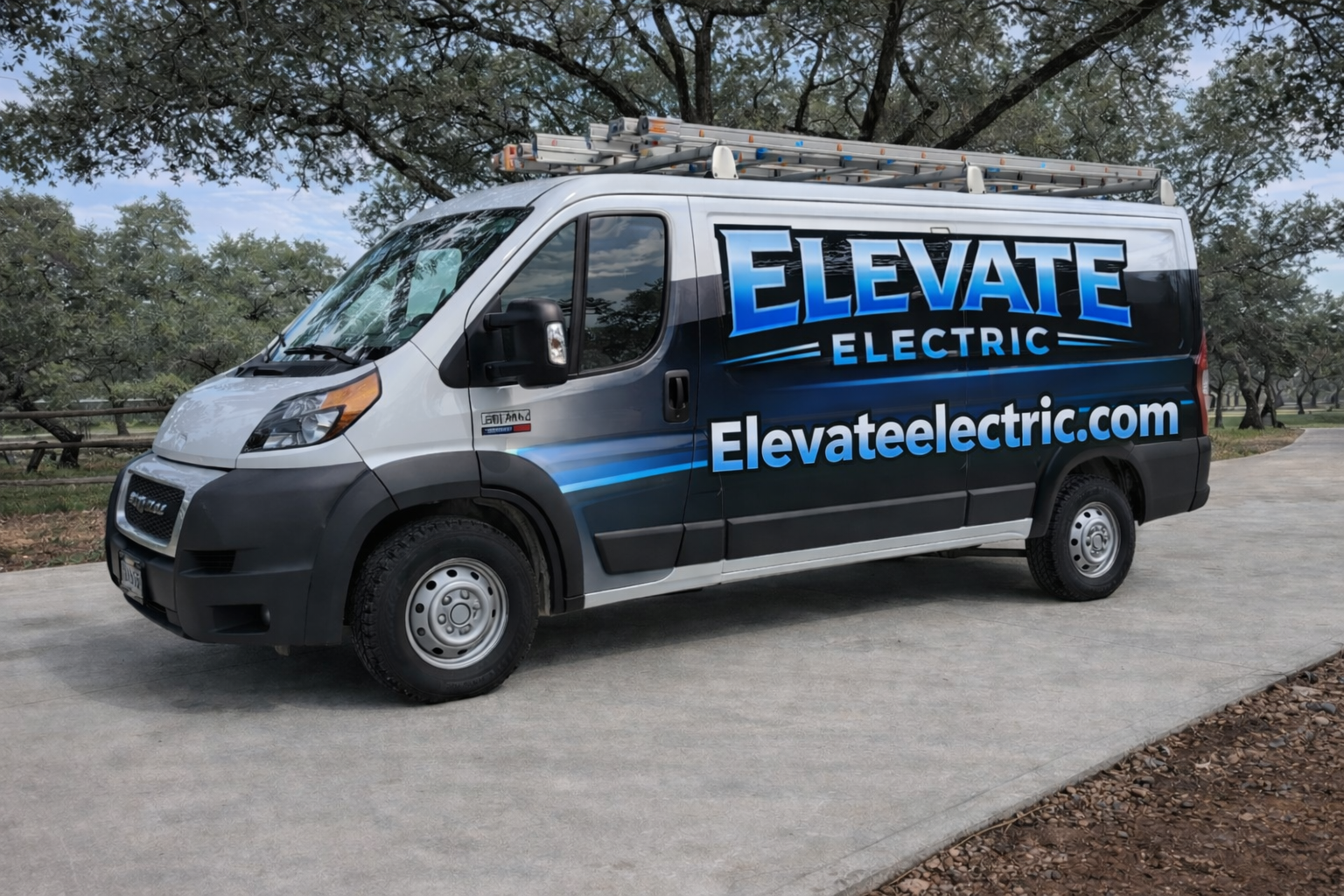 Elevate Electric branded service van parked under oak trees in the Hill Country